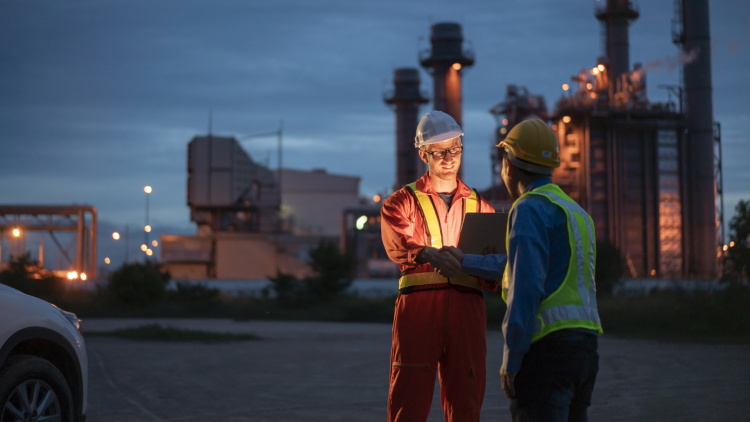 Workers with hard hats in an industrial environment