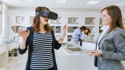 A woman uses a virtual reality headset