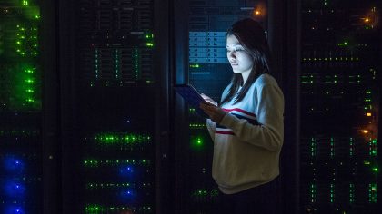 Young-woman-working-on-digital-tablet-in-server-room_960x620
