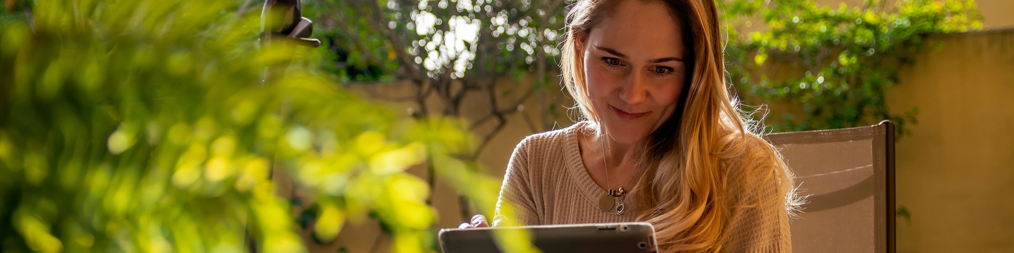 GettyImages - Nested - a woman watches a video on her tablet