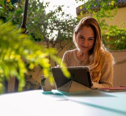 GettyImages - Nested - a woman watches a video on her tablet