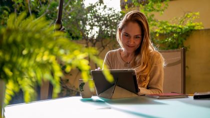 GettyImages - Nested - a woman watches a video on her tablet